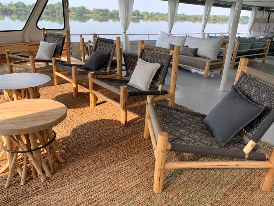 Victoria Falls: 2-Hour Luxury Zambezi River Sunset Cruise - Sunset on the water: colors, calm, and Victoria Falls spray in the distance