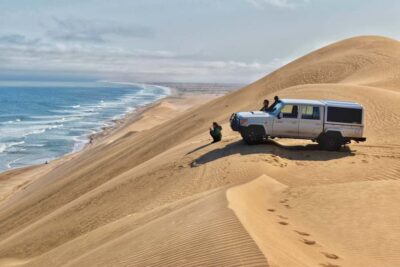 Walvis Bay: Sandwich Harbour Half-Day 4x4 Scenic Excursion - Walvis Bay Lagoon: flamingos and pelicans before the sand