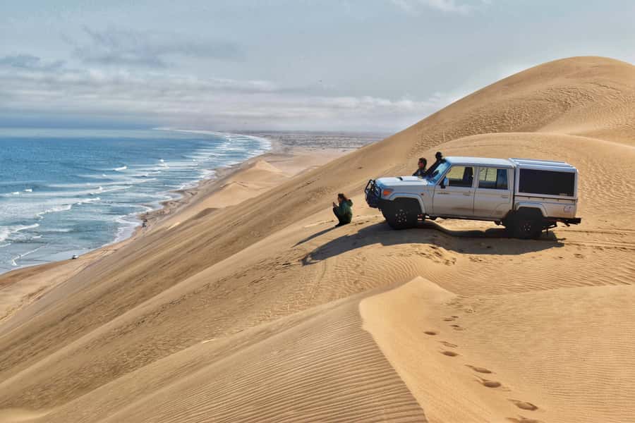 Walvis Bay: Sandwich Harbour Half-Day 4x4 Scenic Excursion - Walvis Bay Lagoon: flamingos and pelicans before the sand